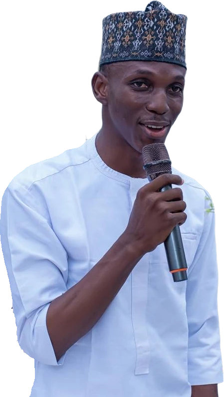 Ustadh Ibraheem speaking to students with a microphone